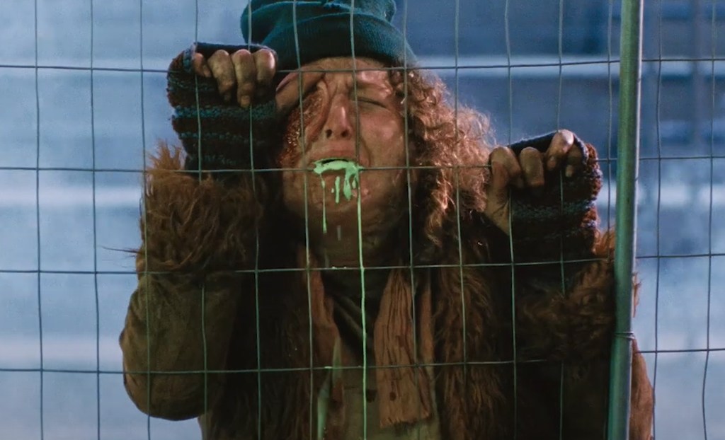 A Lady starts throwing up green stuff. 