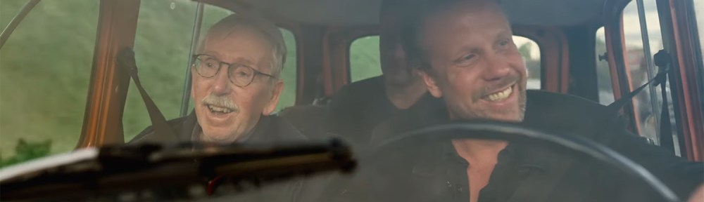 Lars, Filip, and Fredrik laugh in the car.