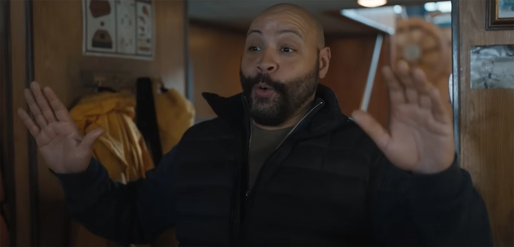 Lester with his hands up.