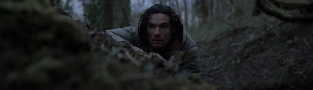 Jake spies over a ridge.