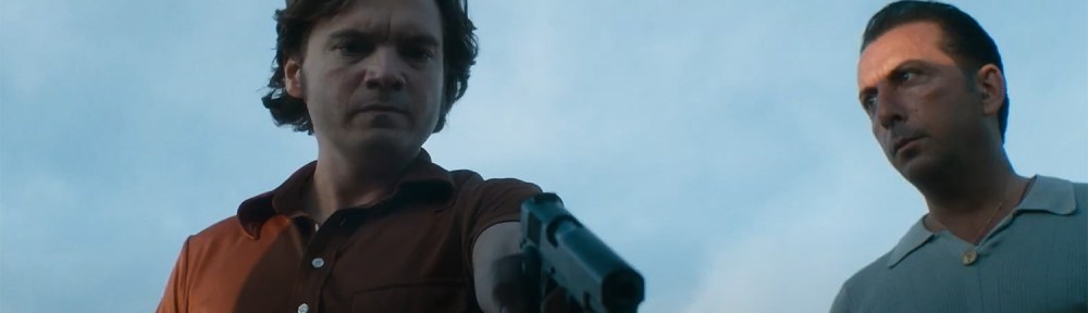 Emile Hirsch holds a gun.