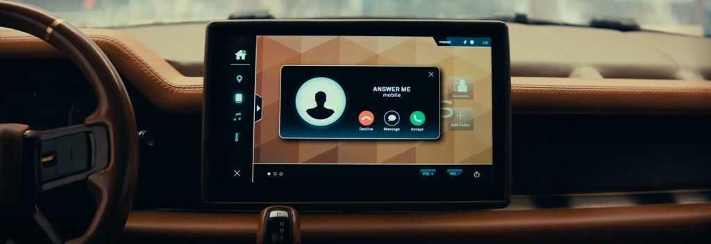 A phone call appears on a car tablet. 