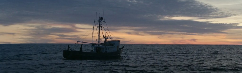 A trawler on the ocean. 