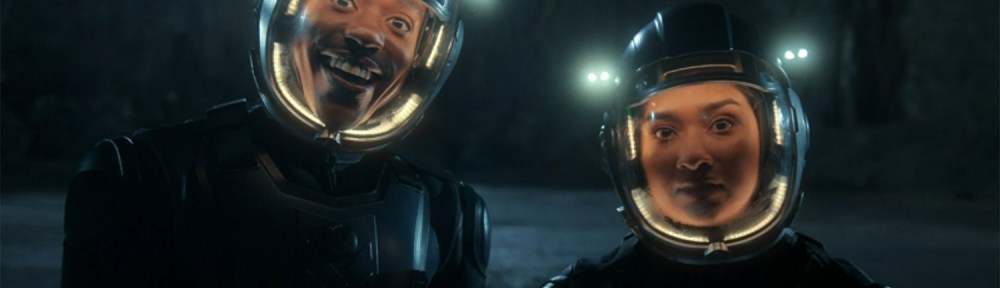 The Doctor and Belinda in space suits.