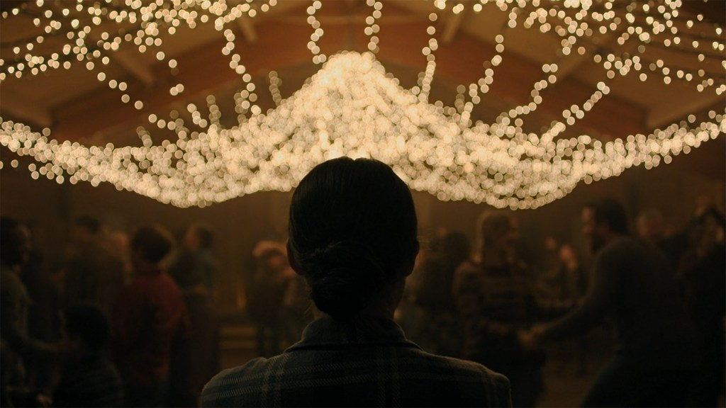 Arriving in a barn dance with lights across the ceiling. 