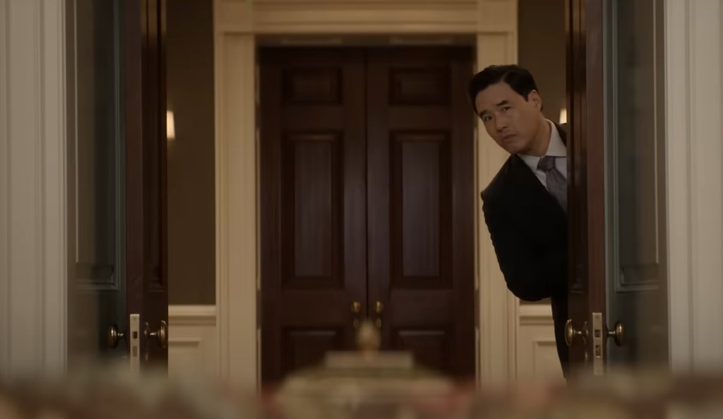 Randall Park pops out from the side. 