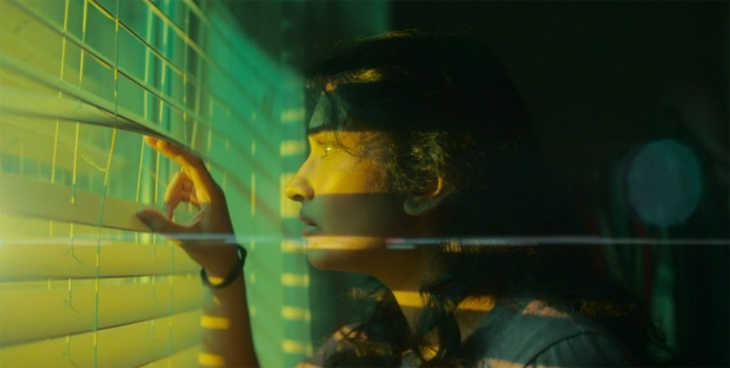 Belinda sees a rocket land next to her house. 