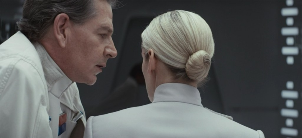 Krennic (Ben Mendelsohn) starts interrogating Dedra (Denise Gough).