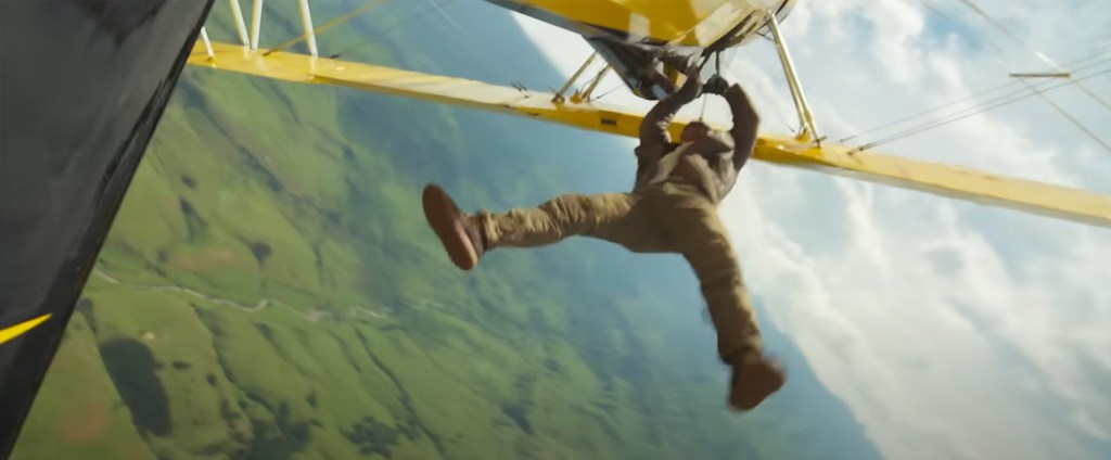 Tom Cruise hanging onto an upside-down plane. 