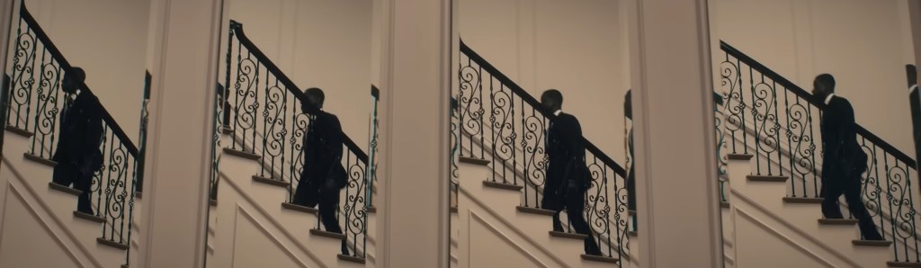 Xavier walks up some stairs. 
