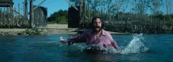 Jamie screams running into the water.