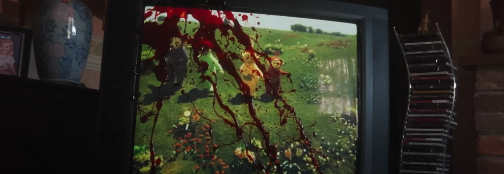 Blood splattered across a television playing Teletubbies. 