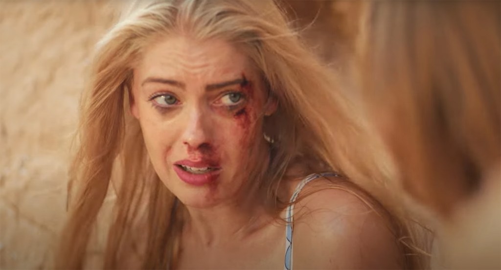 A woman covered in blood. 