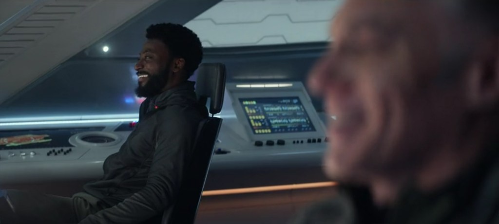 M'Benga and Pike in a shuttle.