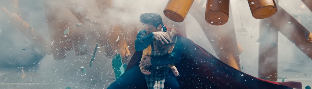 Superman protects a little girl from exploding cylinders.