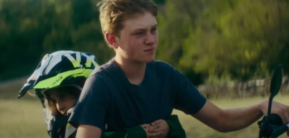 Totone riding his sister to school on a dirt bike.