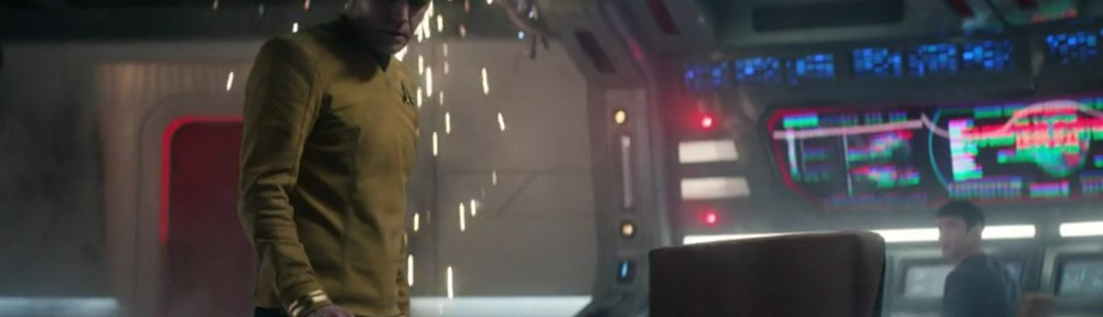 James Kirk looks down at the command chair.