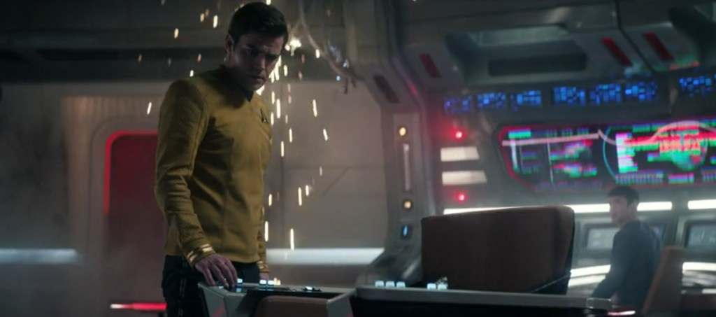 James Kirk looks down at the command chair. 