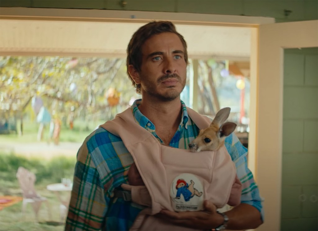 Ryan Corr with a joey in a baby pouch.