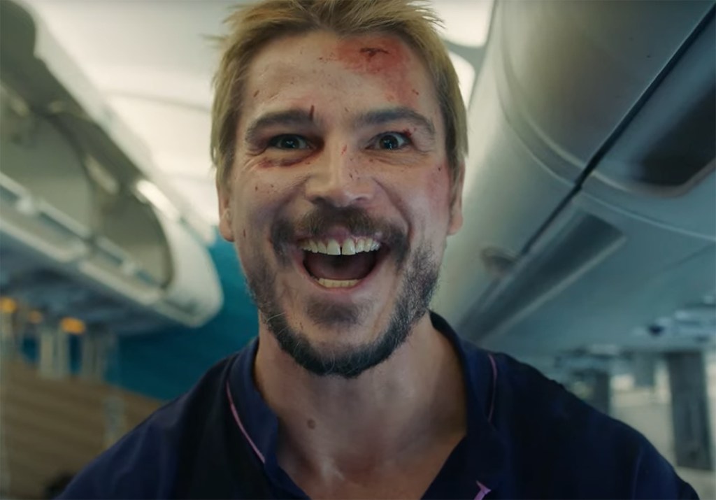 Josh Hartnett with a wild expression on his face.