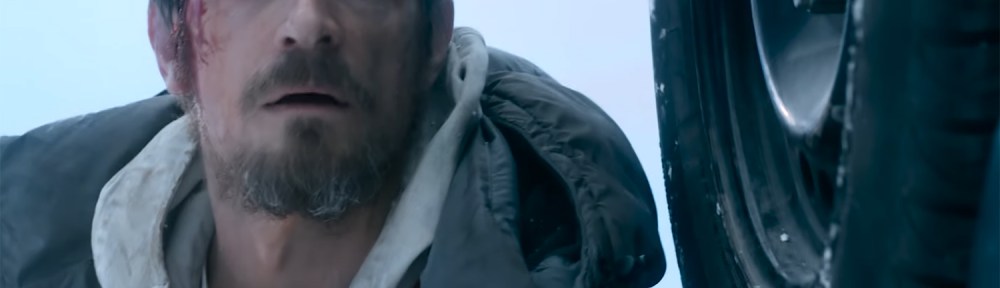 Joel Kinnaman hides from flying bullets.