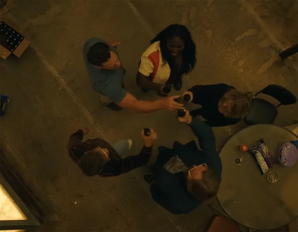 The gang clinking glasses of bear together. 