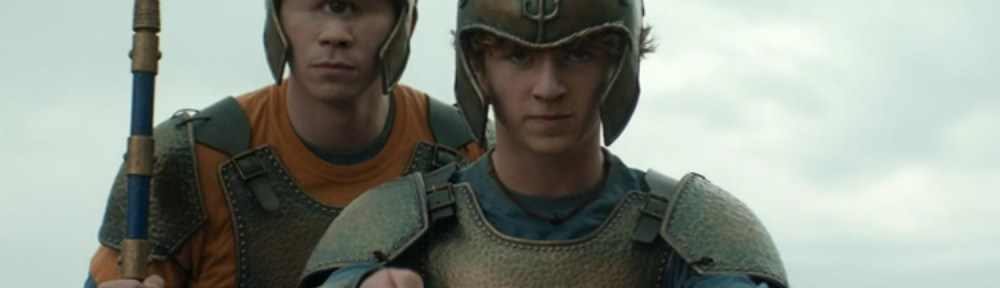 Tyson and Percy on a chariot.