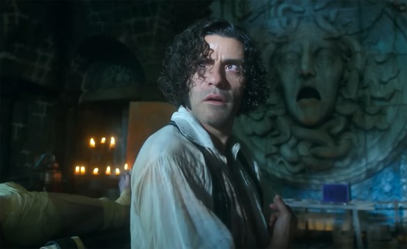 Oscar Isaac cast in light from a lightning strike. 