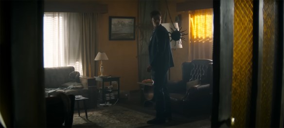 Jack Quaid with a mace in his back.