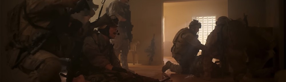 Soldiers work in the aftermath of a explosion.