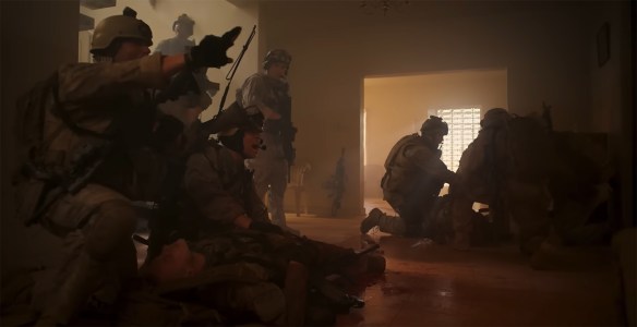 Soldiers work in the aftermath of a explosion.