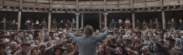 People reach out to Hamlet. Image Credit: Universal Pictures. 