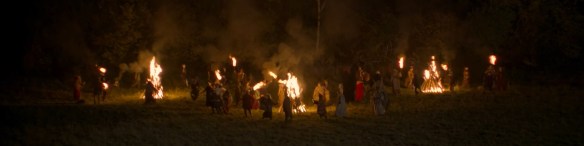 A town dances around fires. 