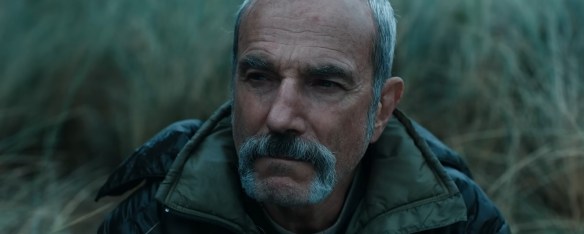 Daniel Day-Lewis in a forest.