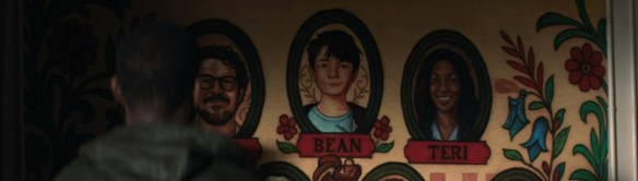 Murals of the survivors on a wall. 