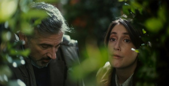 Greg and Katie hiding in bushes. 