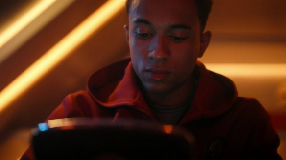 Caleb looking at messages from his mother.