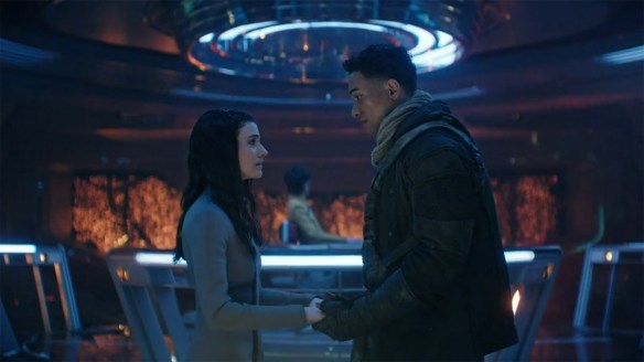 Caleb and Tarima holding hands. 