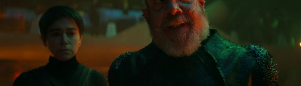 Nus Braka (Paul Giamatti) pontificates.