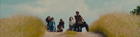 The family coming over a rise.