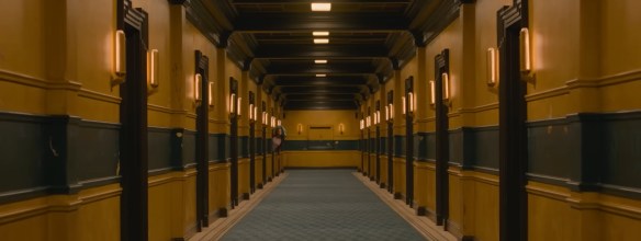 Asia looks down an empty hallway.