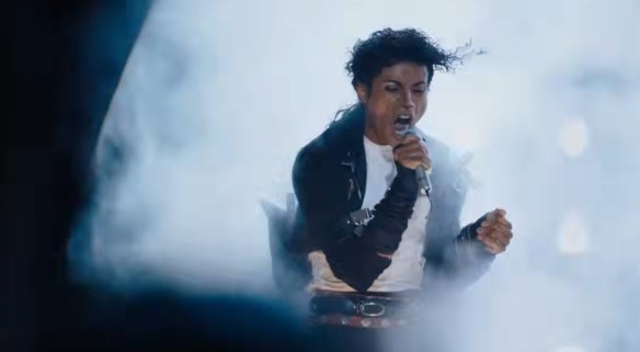 Michael performing as smoke erupts around him.