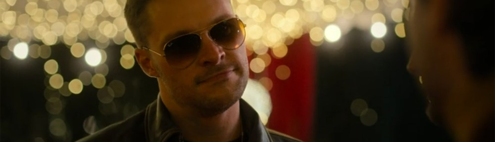 Jack Reynor in sunglasses at night.