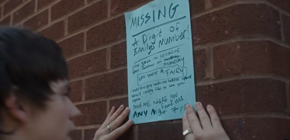 A poster with "Missing,
A Digit of Emily's Number!,
you gave me 10/11th's of your number on MONDAY
you were a FAIRY
I was the guy with no bottle opener who'd really like to see you again
Meet ME Where you found me ANY NIGHT 7pm"