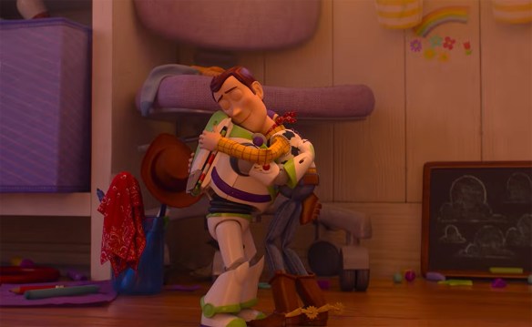 Woody and Buzz hug.