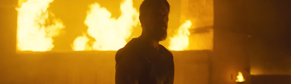 Odysseus in front of a burning building.