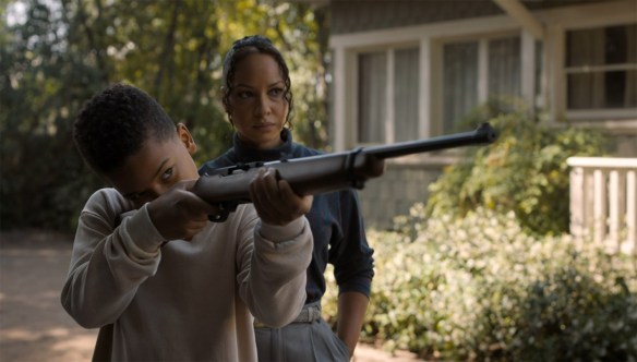 Young John, his mother, and a gun.