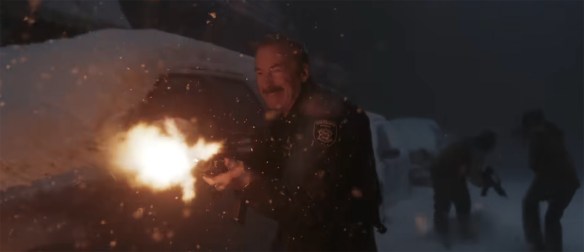 Bob Odenkirk firing a rifle. 