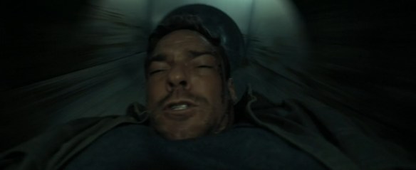 Reacher falling through a trash chute.