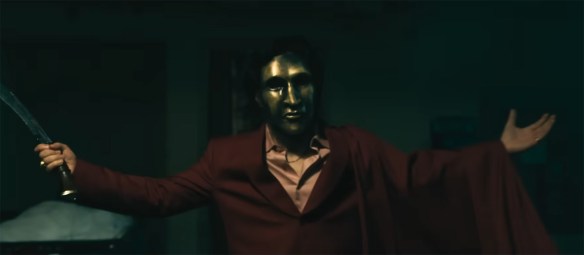 A man in a mask with a knife.